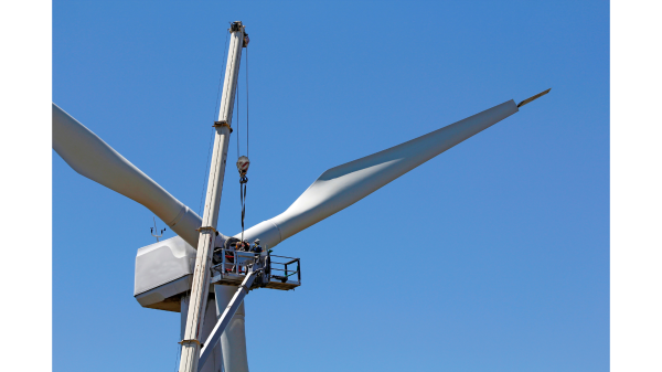 Men performing wind turbine maintenance