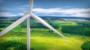 A wind turbine in a vast, green field